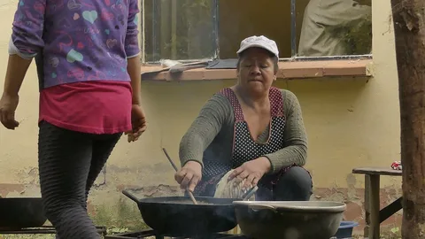 Tacana coffee producer roasting in San Silvestre Napashi, Bolivia