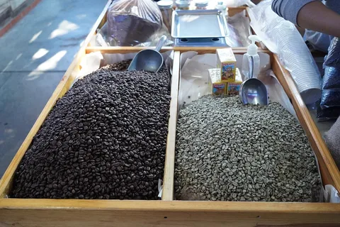 Green and roasted coffee beans at the Tlacolula market, Oaxaca, Mexico